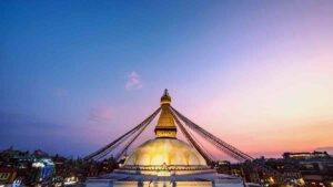 Nepal stup temple in Nepal under the sunset sky.
