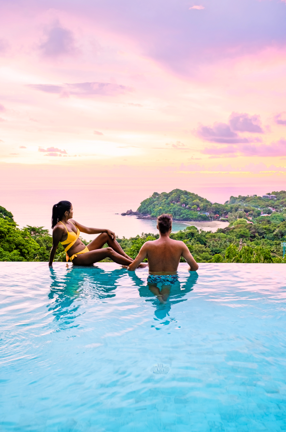 couple in luxury villas overlookimg the ocean