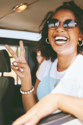 woman-smile-and-road-trip-show-peace-in-car
